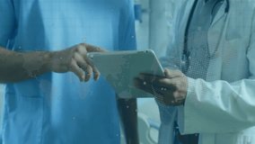 Animation of data processing connections over diverse doctors with tablet. Global medicine, connections, computing and data processing concept digitally generated video. - Powered by Shutterstock - Get 15% off with code: PIKWIZARD15
