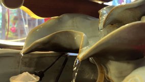 Small porcelain waterfall on top of Buddha statuette Asia - Powered by Shutterstock - Get 15% off with code: PIKWIZARD15