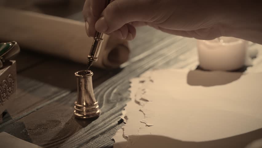 Antique female writing with old feather pen. Woman in renaissance dress writing a love letter with vintage quill pen on old parchment papers sheet.