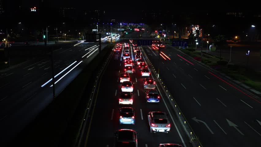 Busy fast Traffic flow , city  night traffic pulse.Kaohsiung City,Taiwan. 4K. Drone aerial high angle view. Time lapse. - Powered by Shutterstock - Get 15% off with code: PIKWIZARD15