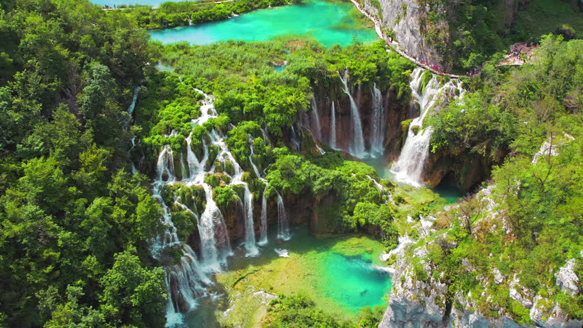 Plitvice Lakes National Park in Croatia. Summer mountain landscape with streams with emerald green water and waterfalls.