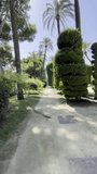 First person view, fpv, pov, walking through park gardens in Cadiz, Andalusia, Spain, Europe. Vertical video