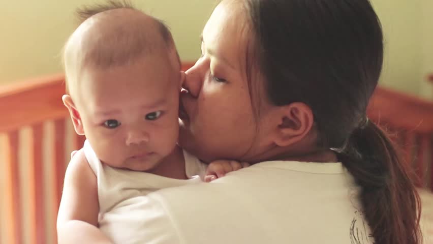 Mother carries her baby with love. (slowmotion) | Shutterstock HD Video #34612876