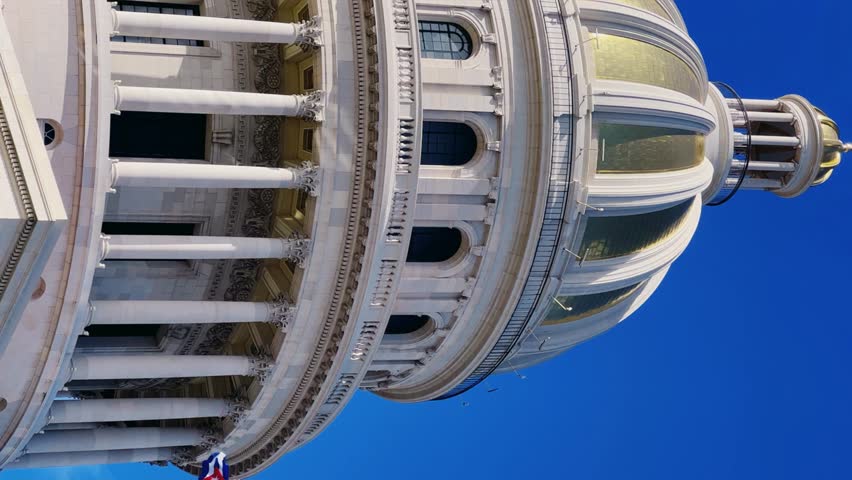 The famous building of the National Capitol in Cuba. HAVANA - DECEMBER 20, 2023: The entrance staircase and the dome of the Capitol in the center of Havana against the background of a blue sunny sky.