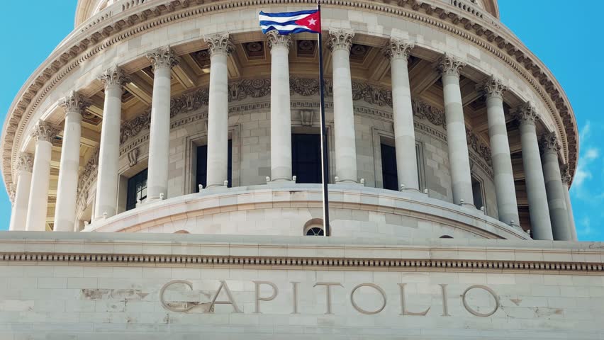 The famous building of the National Capitol in Cuba. HAVANA - DECEMBER 20, 2023: The entrance staircase and the dome of the Capitol in the center of Havana against the background of a blue sunny sky.
