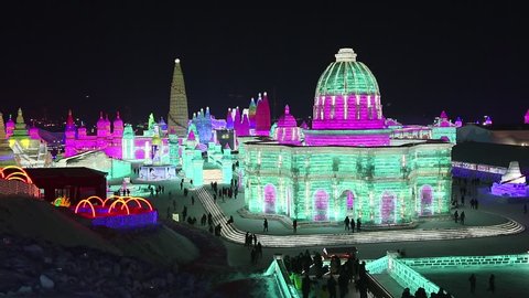 HARBIN,CHINA - JANUARY 5,2018 :CROWD walking in  19th ICE-SNOW World in this year is themed as "Ice Snow Blooming Garden, Fantastic World"