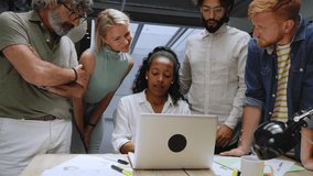 Diverse team of business professionals gathered in office conference room. Creative group around table female leader. Colleagues talk marketing campaign, social media strategy. People modern workplace - Powered by Shutterstock - Get 15% off with code: PIKWIZARD15