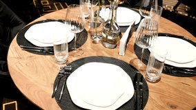 Elegantly made empty dinner tables in a chic restaurant shot with a slider - Powered by Shutterstock - Get 15% off with code: PIKWIZARD15