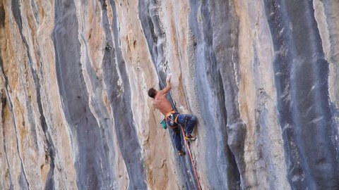 
A man climbs the rock and breaks down. Extreme. Rock climbing. Falling into the abyss. Height. Sport. Rocks. Turkey. Geyikbayiri. Rope. The rescue. Tension.