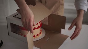 cake in a box. slow-motion video. High-quality shooting in 4K format