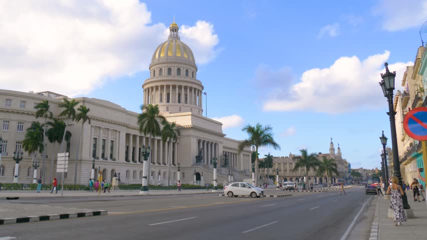 National Capitol (Capitolio Nacional) building. Dome of the Capitol against the blue cloud sky. Havana, Cuba. Capitolio entrance stair, south side, Havana Cuba.