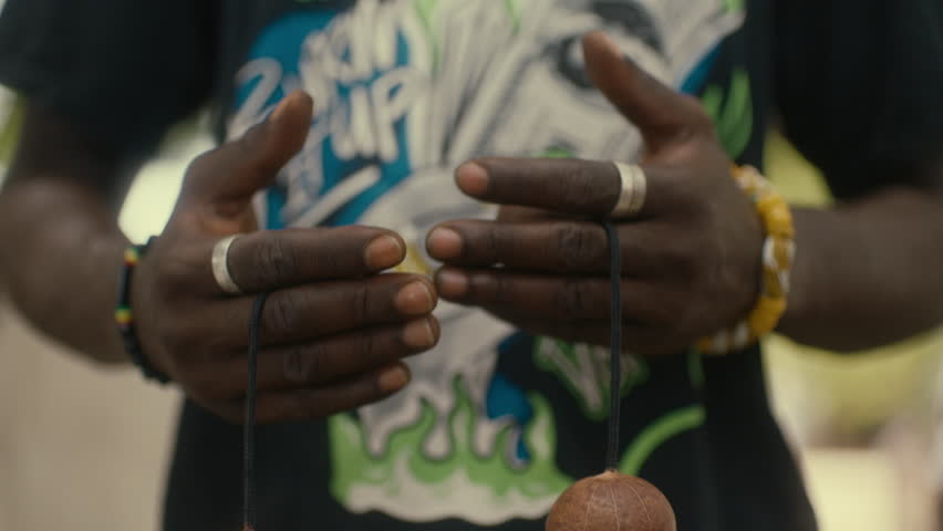 African Man Swinging Kashaka toy