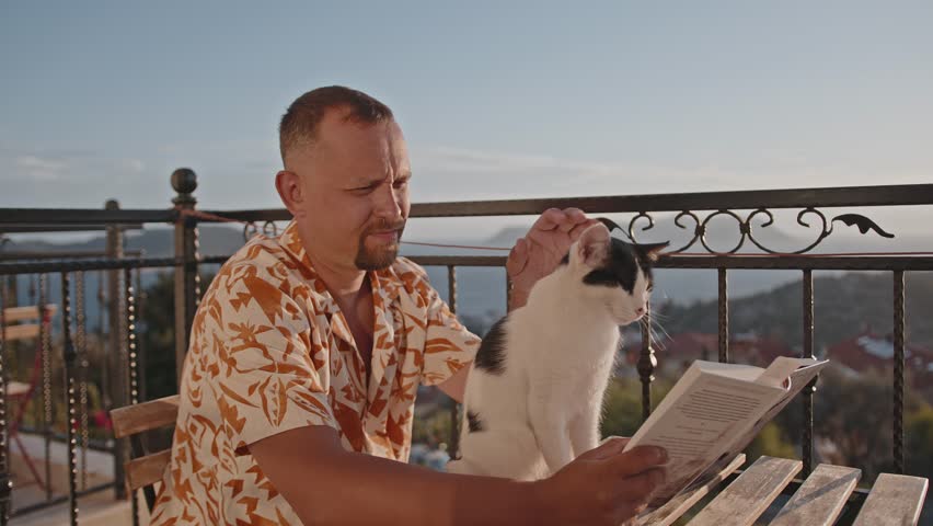 A man with a large backpack and hiking equipment in the mountains.