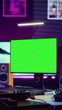 Vertical Video Artist learning to play at electronic piano keyboard in home studio, watching tutorial online with greenscreen display. Music producer practices playing on midi controller synthesizer