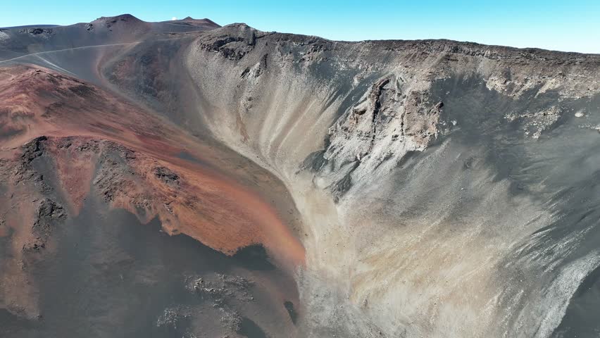 Haleakala Crater looms 10,023 feet above the Pacific Ocean, taking up three-quarters of Maui’s 727 square miles. Haleakala sunrise inspire 1.5 million visitors annually. Royalty-Free Stock Footage #3462002657