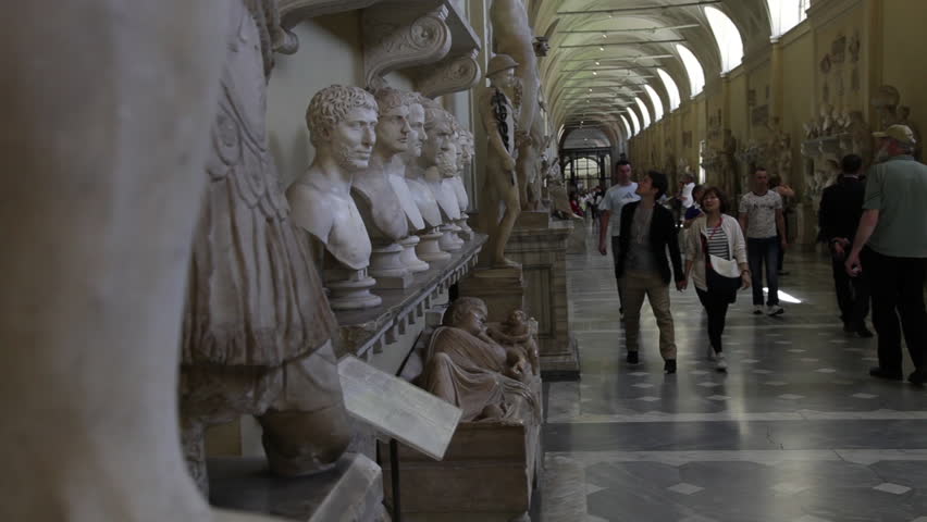 VATICAN CITY - MAY 5, 2012: A couple walks down the Gallery of Busts in the