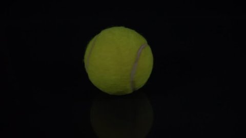 Slow motion video of a tennis ball spinning