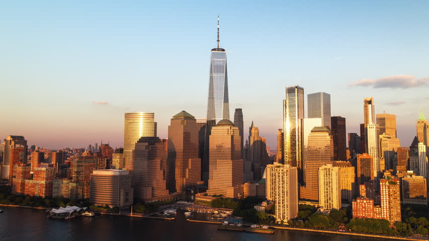 Establishing Aerial View Shot of New York City NY, NYC, United States, golden hour, beautiful light, sunset, Downtown Manhattan, One World Trade Center, Wall Street, New York Stock Exchange Royalty-Free Stock Footage #3462121457