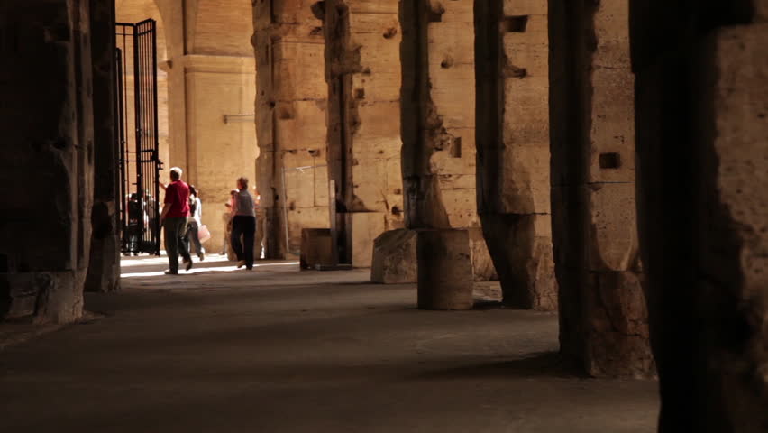 ROME - CIRCA MAY 2012: Tourists roam among columns and a tall doorway in the