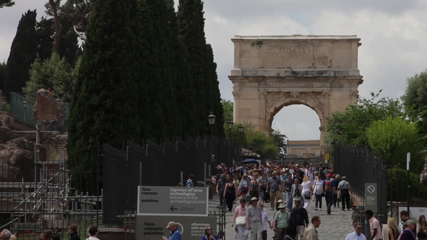 ROME - CIRCA MAY 2012: View of Arch of Titus and tourists seen walking near the