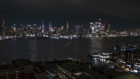 Aerial View Shot of New York at night, evening City NY, NYC, United States, Uptown Manhattan, Flatiron Building, Empire State Building, Rockefeller Center, Times Square, Hudson Yards