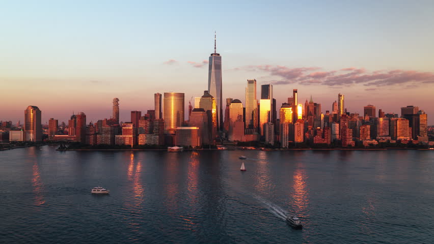 Establishing Aerial View Shot of New York City NY, NYC, United States, golden hour, beautiful light, sunset, Downtown Manhattan, One World Trade Center, Wall Street, New York Stock Exchange Royalty-Free Stock Footage #3462169303