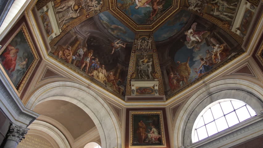 VATICAN CITY - MAY 5, 2012: Tourists take photos of a ceiling fresco of the