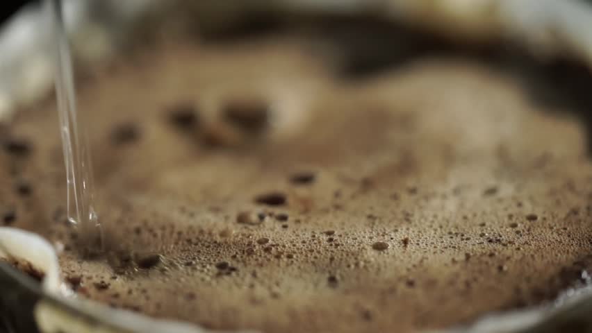 Making coffee by drip. Close-up of making coffee with coffee paper. 