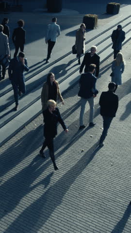 High Angle Shot of Office Managers and Business People Commuting to Work in the Morning or from Office on a Sunny Day on Foot. Video Footage with Vertical Screen Orientation 9:16.Smartphones.