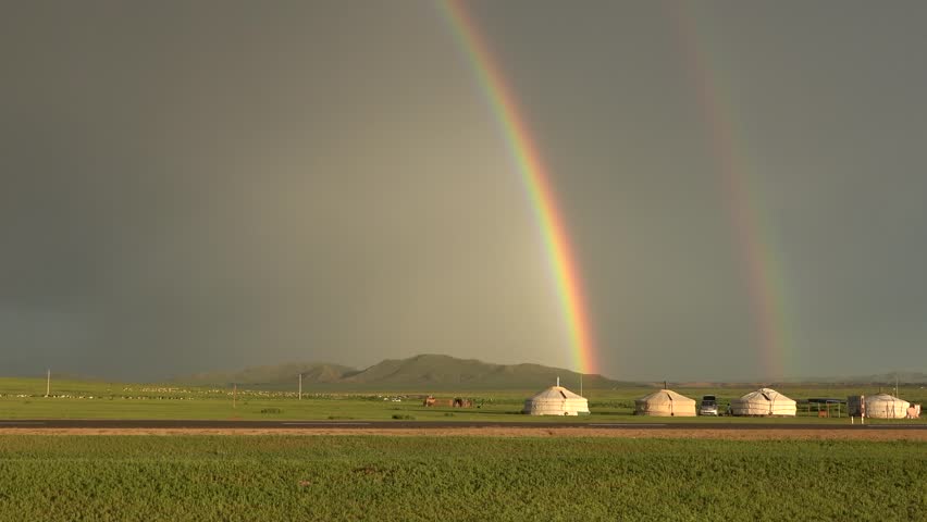 Desertic grass land Gobi desert exploration adventure landscapes wide horizon majestic green planes smooth mountains tracks in the land path finder direction navigation wildlife freedom 