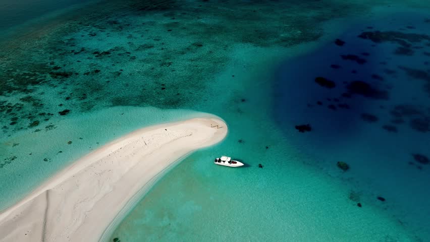 Aerial view of beautiful Maldives with clear blue water and white sandbank, South Ari Atoll, person.
