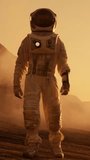 Astronaut on Mars Walking on the Exploring Expedition. In the Background His Base Research Station. First Manned Mission To Mars. Video Footage with Vertical Screen Orientation 9:16
