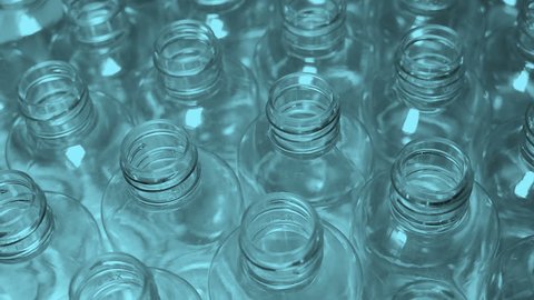 Manufacture of plastic bottles for the cosmetic and food industries. Garbage processing, secondary use. Earth pollution. Smooth rotation.