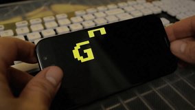 Browsing or watching on a smartphone: a funky colorful 4k game over screen animation, letters falling towards the center. 8 bit retro style, red and yellow.
