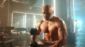 After laying down his dumbbell, a man crosses his arms and looks toward the camera with a satisfied smile, signaling the end of a successful workout. Camera 8K RAW.  - Powered by Shutterstock - Get 15% off with code: PIKWIZARD15