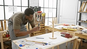 African american man photographing wooden object in a well-lit carpentry workshop indoors - Powered by Shutterstock - Get 15% off with code: PIKWIZARD15