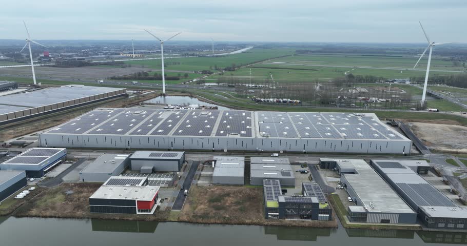 Aerial drone view on a solar powerd energy distribution center in The Netherlands. Logistics and sustainable company. Top down overview. Royalty-Free Stock Footage #3462534579