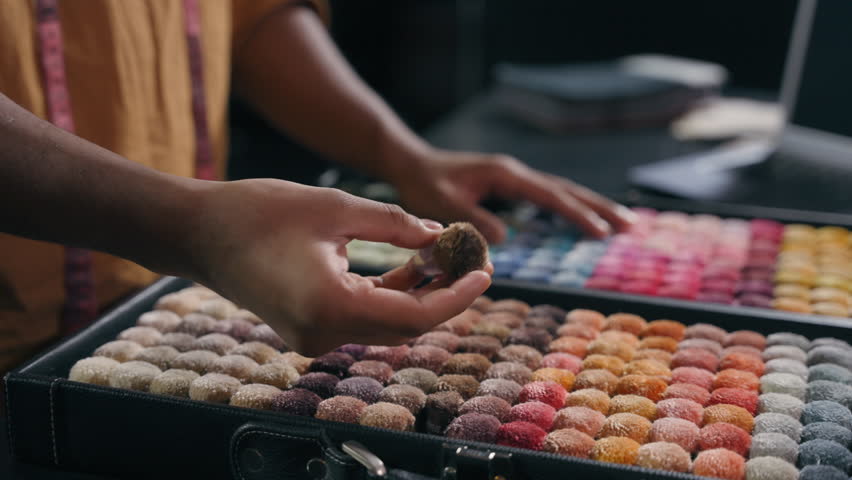 Cropped shot male hands choose swatches box soft furry fluffy material clothes choosing accessories of color fabric catalog close up unrecognizable man tailor designer buying shooping fashion atelier