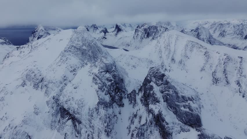 Aerial view of the Lofoten fiords, Norway, covered by snow in winter. peaks winter mountains