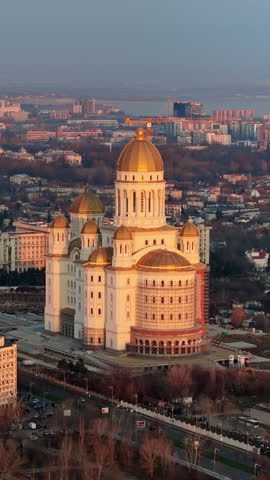 Vertical aerial drone view of People's Salvation Cathedral near the Palace of the Parliament. Sunset in Bucharest, Romania Royalty-Free Stock Footage #3462642925