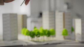 In an area with an environmentally friendly zone and modern buildings, the keys to a new house are handed over from the realtor to the buyer. Buying a home in an ecologically clean area - Powered by Shutterstock - Get 15% off with code: PIKWIZARD15