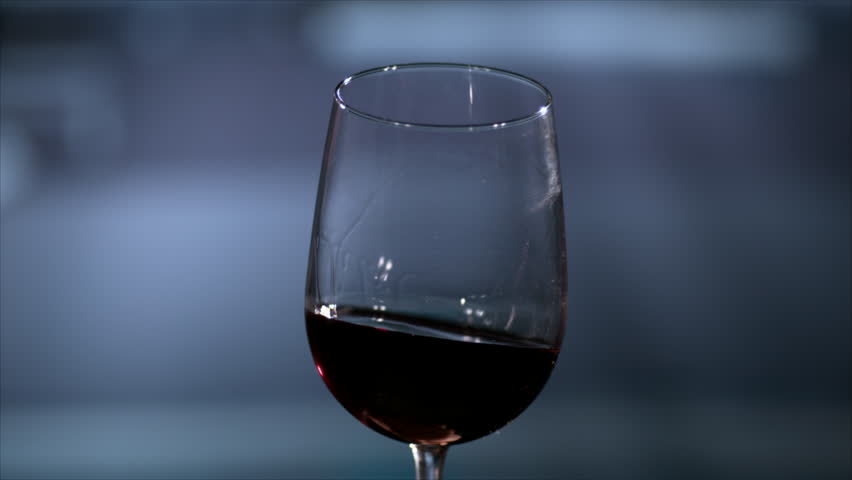 Red wine aerating in a stemmed wine glass slowly Royalty-Free Stock Footage #3462672097