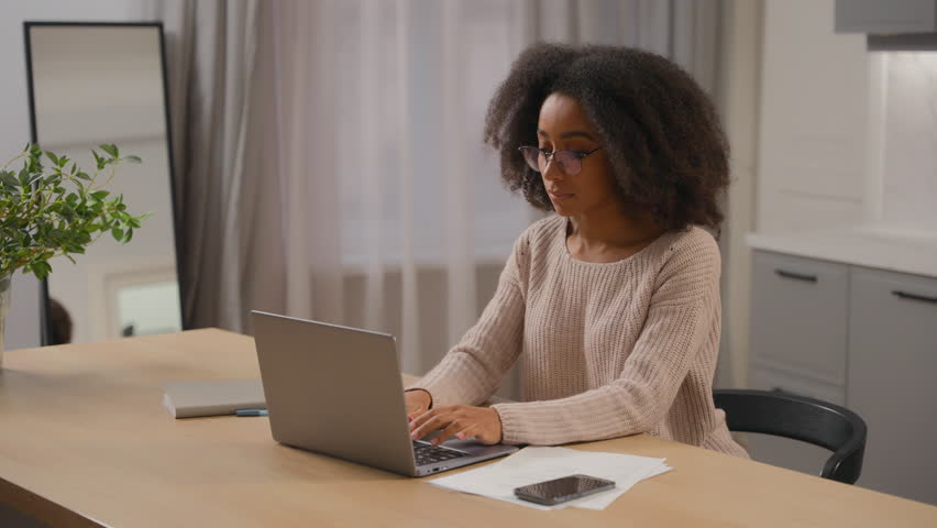 African girl American business woman freelancer working laptop at home kitchen finish distant work tired businesswoman close computer notebook taking off glasses exhausted dry eyes strain eye tension Royalty-Free Stock Footage #3462675785