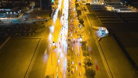 Drone hyperlapse of King Fahad Road showing KAFD at night in Riyadh, Saudi Arabia