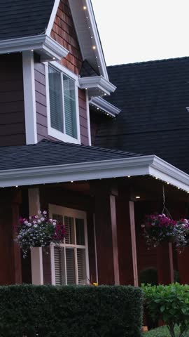 Custom built big luxury house with triple garage doors in a residential neighborhood. Suburbs of Vancouver Surrey Canada.