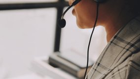 close up headphone asian girl press number on telephone and response answer customer or partner in operation room for business and technology concept. - Powered by Shutterstock - Get 15% off with code: PIKWIZARD15