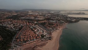 slow-motion aerial video with cinematic style on city of Algeciras Spain with panoramic view of city and coastline during picturesque sunrise