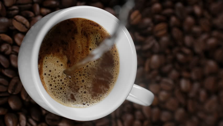 Pouring hot water in white cup with instant coffee. Vertical video