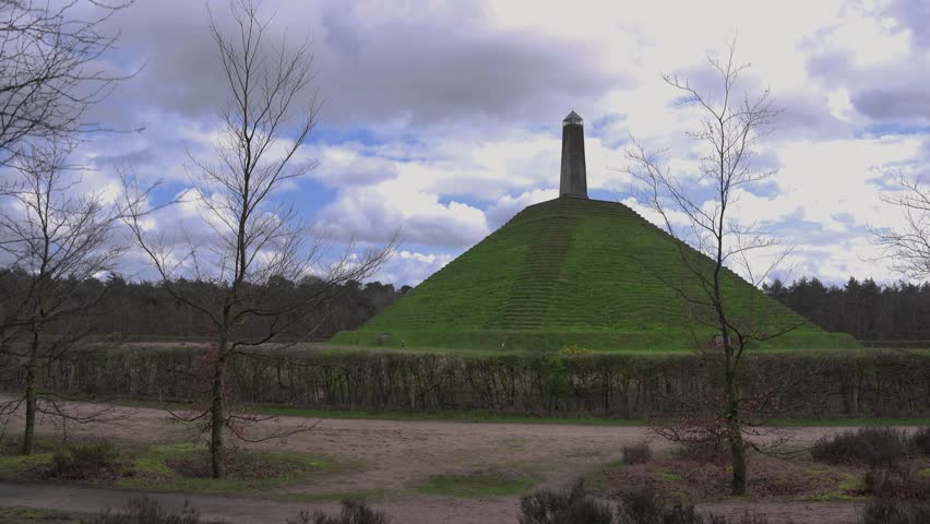 One of the highest points of the Utrecht Hill Ridge, Woudenberg. View of the Pyramide van Austerlitz in Zeist, Netherlands on a cloudy day of spring 4k