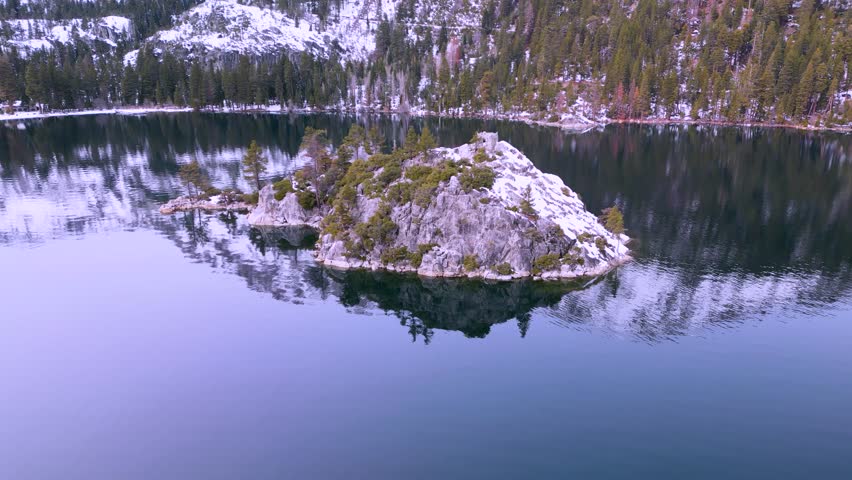 Aerial view of Fannette Island water reflection with mountains, Emerald Bay, Lake Tahoe, California